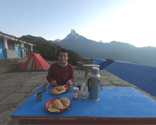 Breakfast At Dawn With Mount Fishtail On Background