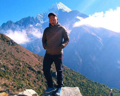 Posing With Mount Thamserku
